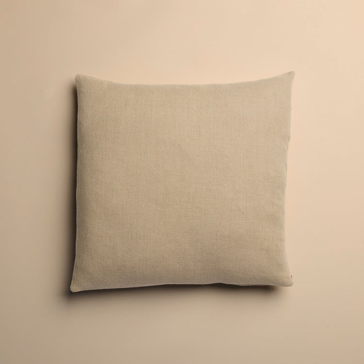 Beige pillow on a beige background