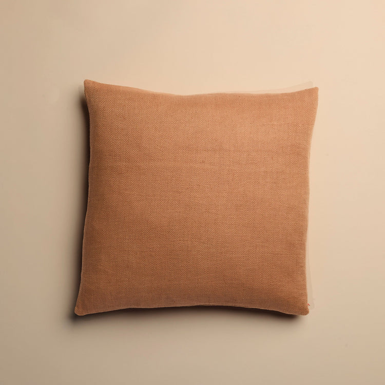 clay pink pillow on a beige background