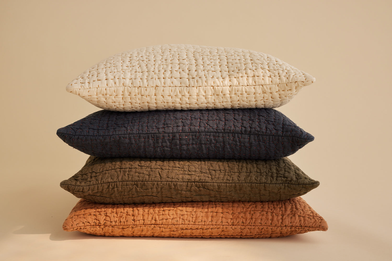 Jasper Collection, Hand Quilted Hemp Pillows in stack of four colors.