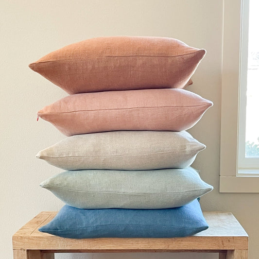 stack or square throw pillows in range of colors