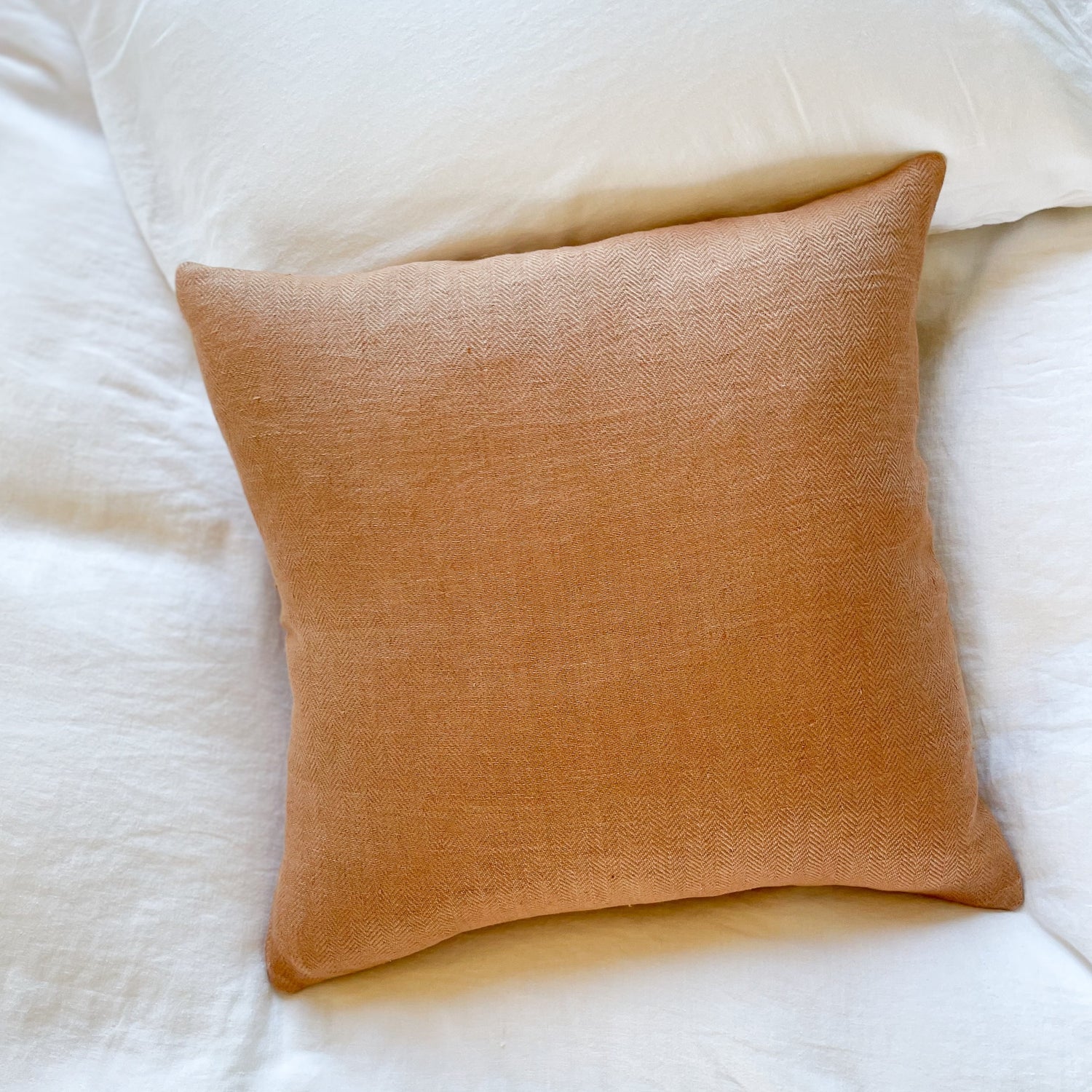 Clay colored square throw pillow
