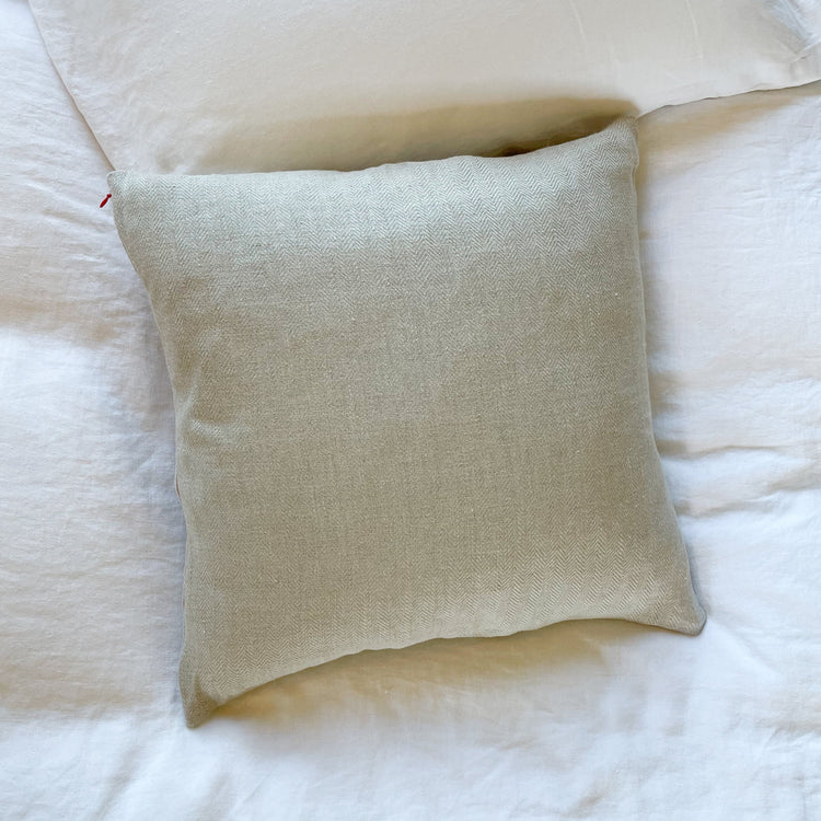 Square throw pillow in natural, un-dyed color