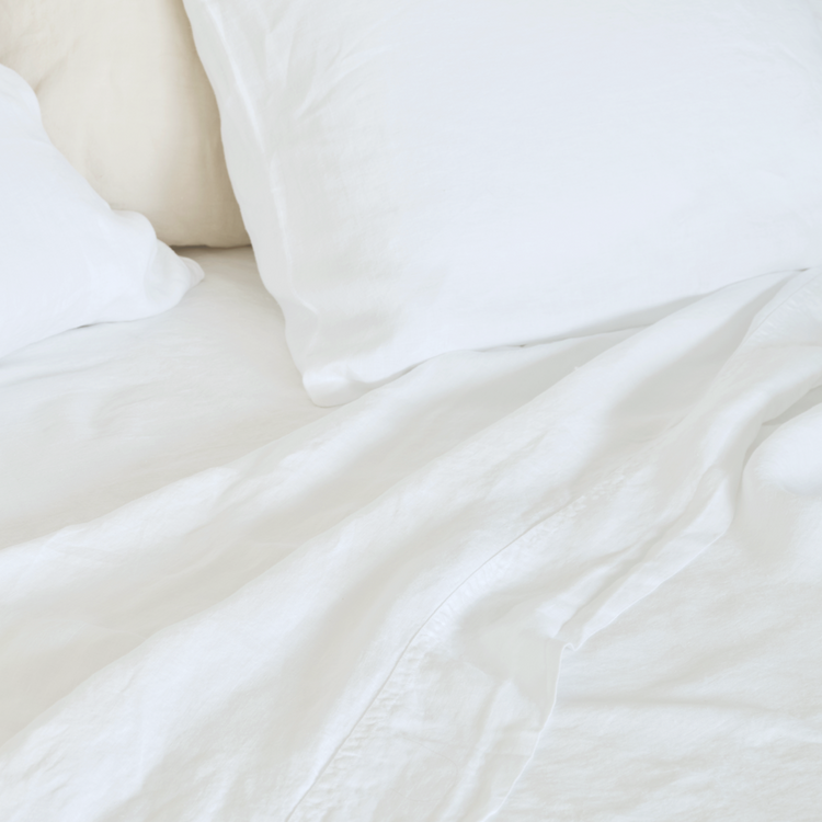 Hemp Top Sheet in close-up, White on bed with pillows in white hemp pillowcases